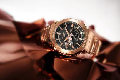 g shock 2100 full metal rose gold on a clothe